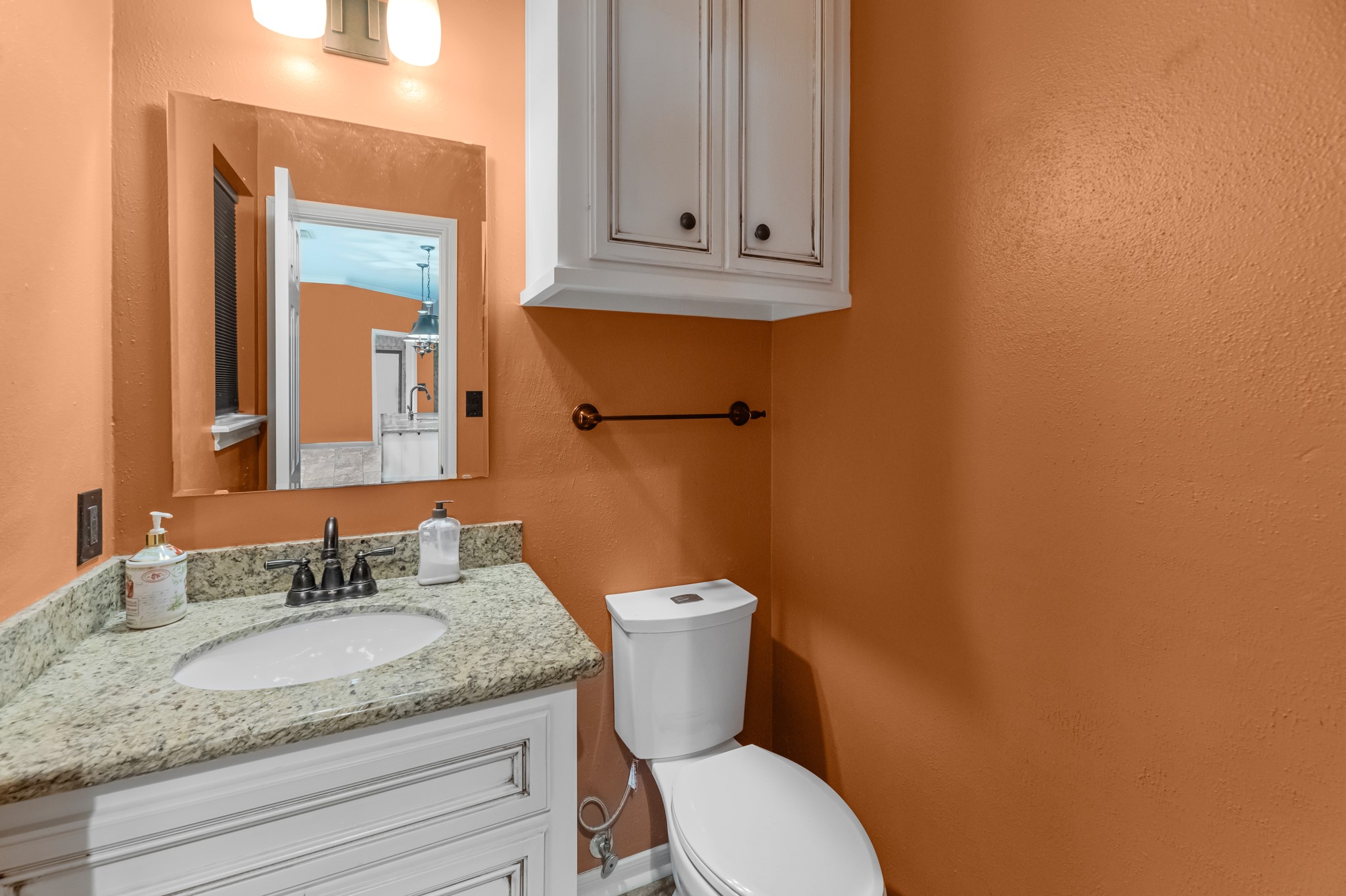 17126 County Road 39 Rosharon, TX 77583 - Photo 41 of 47 a bathroom with a granite countertop toilet sink and mirror