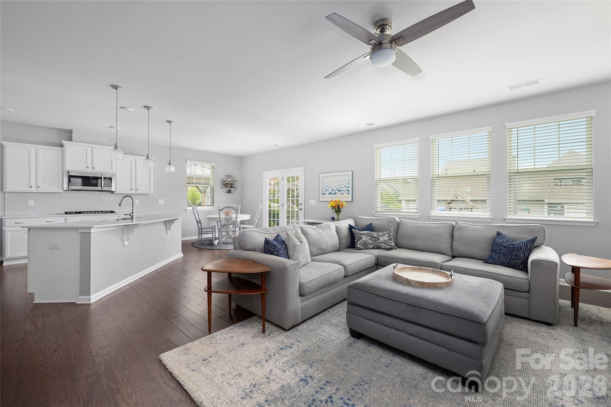 17219 Shearer Road Davidson, NC 28036 - Photo 9 of 34 a living room with furniture white walls and kitchen view