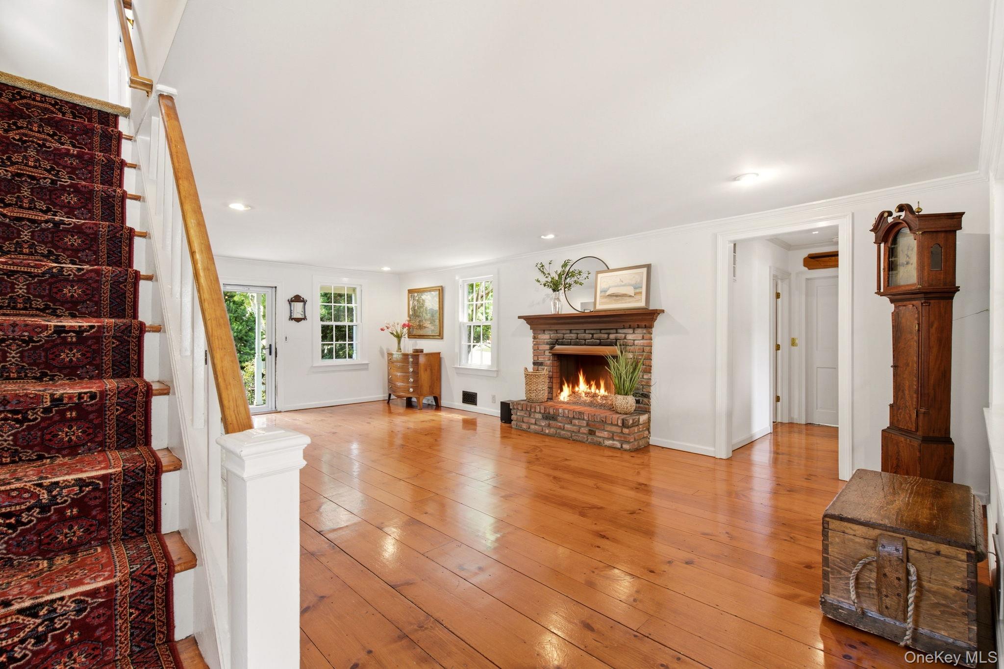 33 Prospect Road Centerport, NY 11721 - Photo 7 of 48 Spacious Living Room shows hallway to first floor primary suite.
