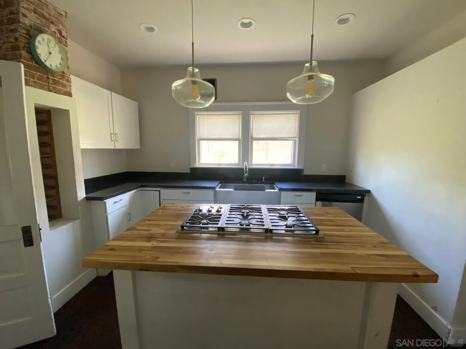 208 West 7th Avenue Escondido, CA 92025 - Photo 11 of 11 a kitchen with a counter space a sink and appliances