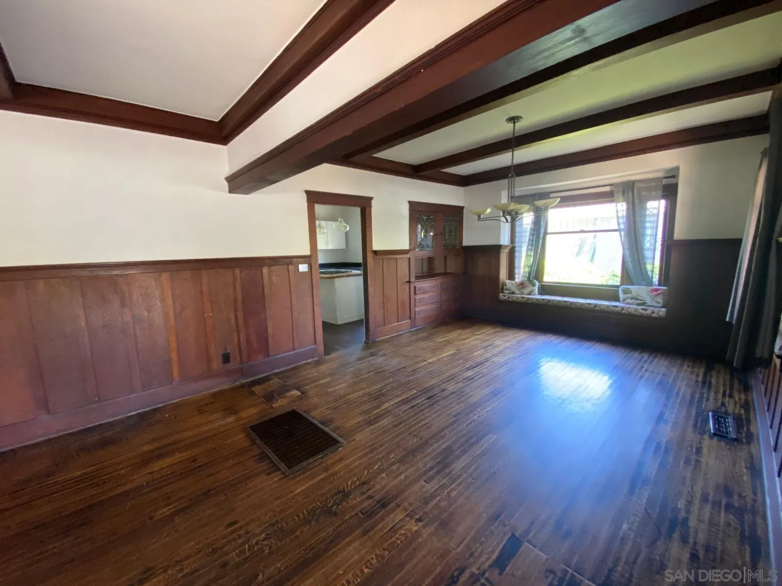 208 West 7th Avenue Escondido, CA 92025 - Photo 6 of 11 a view of a room with wooden floors and stairs