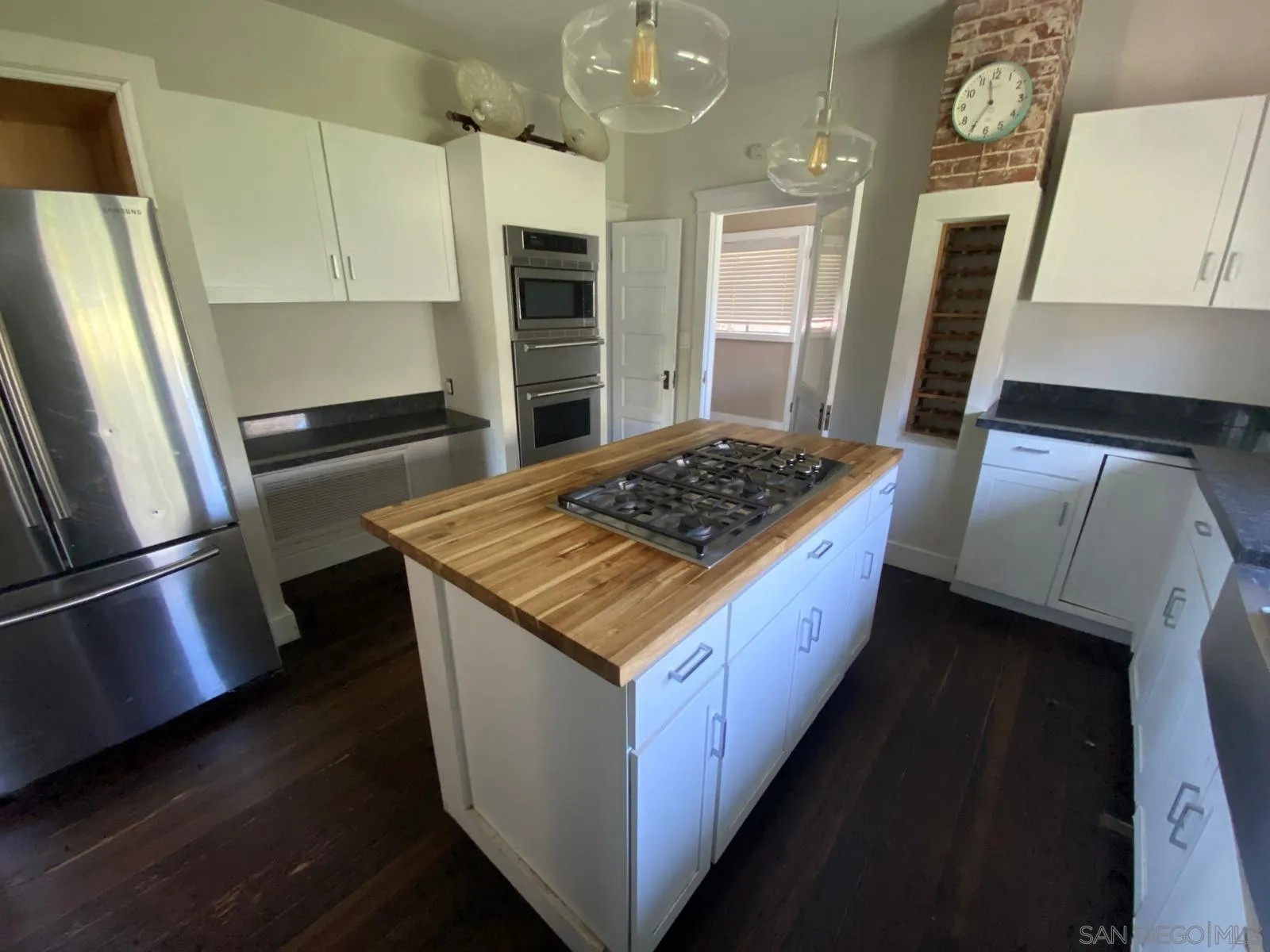 208 West 7th Avenue Escondido, CA 92025 - Photo 9 of 11 a kitchen with stainless steel appliances granite countertop a stove a refrigerator a sink and dishwasher