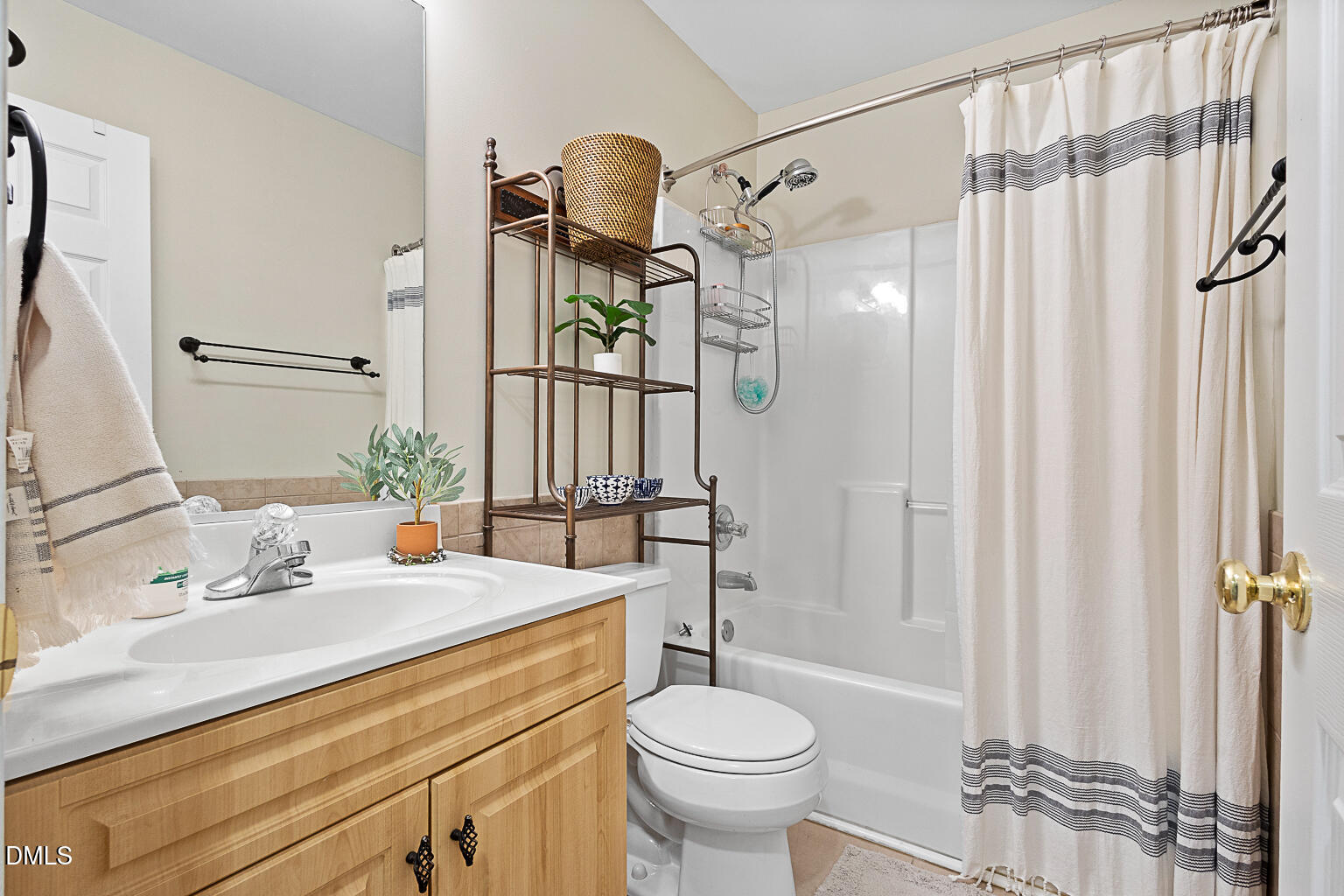 2907 Andover Glen Road Raleigh, NC 27604 - Photo 27 of 39 a bathroom with a sink a toilet and shower