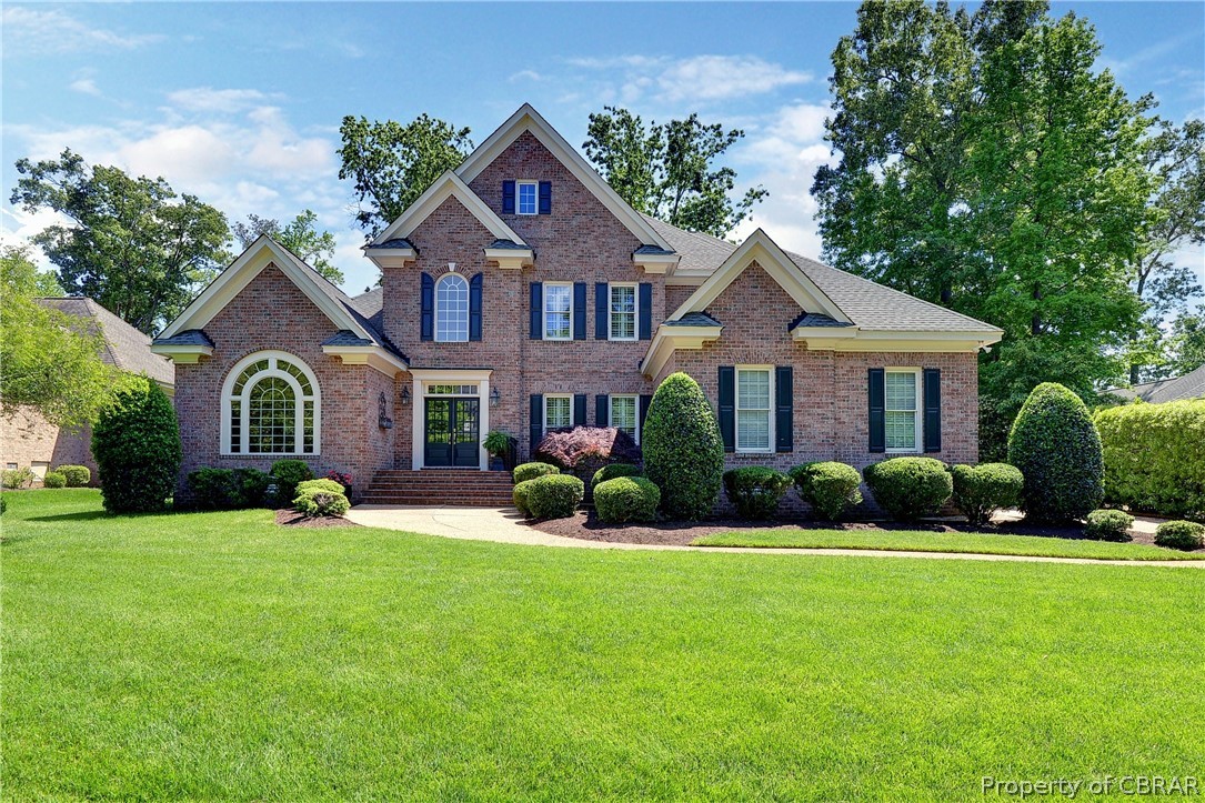 1632 River Ridge Williamsburg, VA 23185 - Photo 1 of 49 a front view of a house with a yard and garage