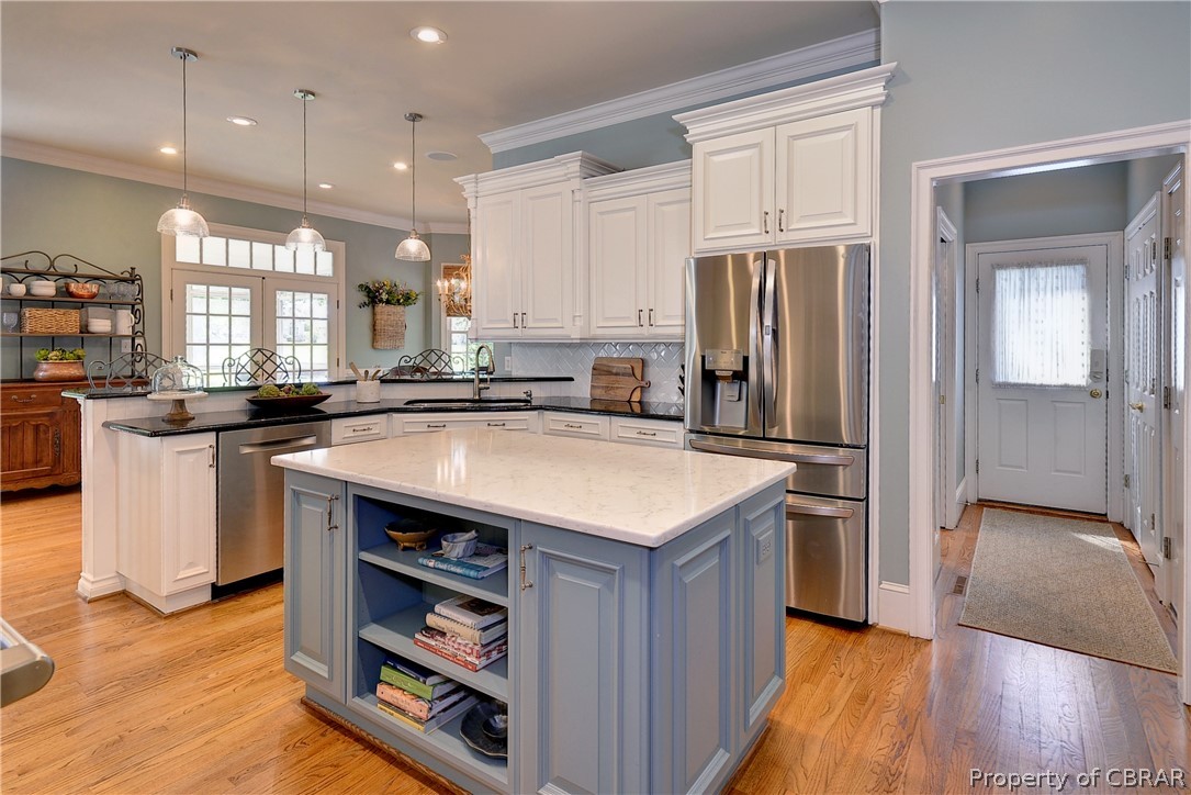 1632 River Ridge Williamsburg, VA 23185 - Photo 14 of 49 a kitchen with stainless steel appliances granite countertop a sink a stove and a refrigerator