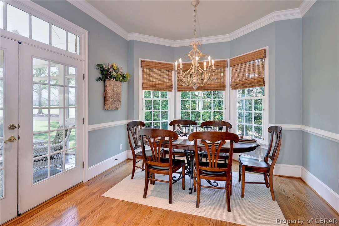 1632 River Ridge Williamsburg, VA 23185 - Photo 16 of 49 a view of a dining room with furniture wooden floor and chandelier