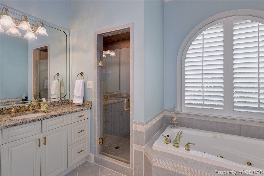 1632 River Ridge Williamsburg, VA 23185 - Photo 25 of 49 a bathroom with a tub a sink and a mirror