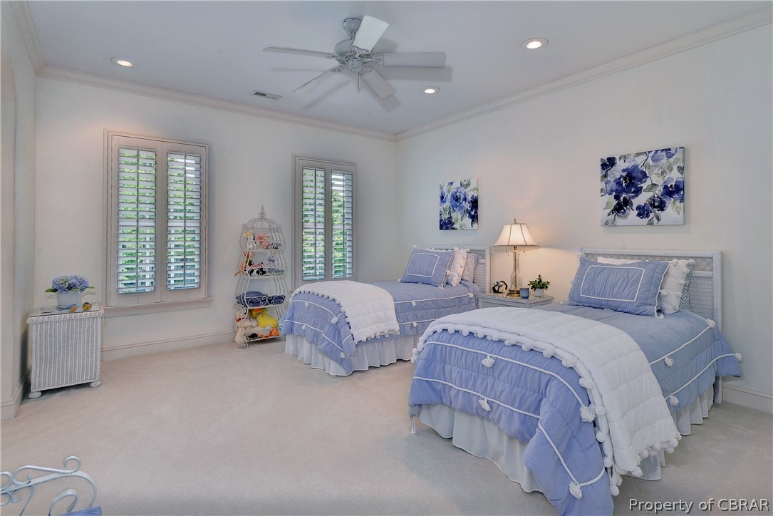 1632 River Ridge Williamsburg, VA 23185 - Photo 32 of 49 a spacious bedroom with two beds and a chandelier