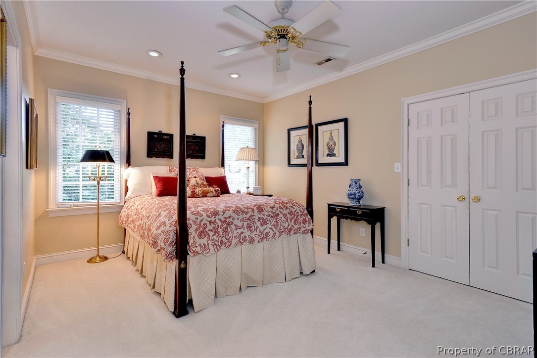 1632 River Ridge Williamsburg, VA 23185 - Photo 35 of 49 a bedroom with a bed and a chandelier
