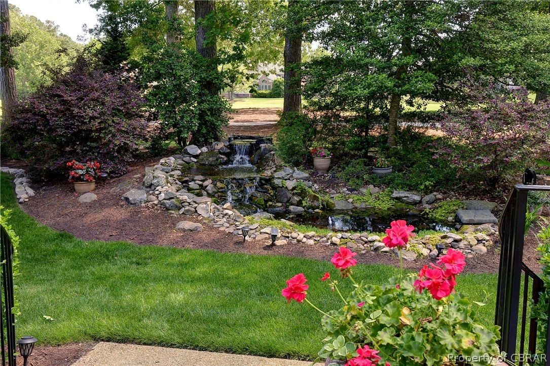 1632 River Ridge Williamsburg, VA 23185 - Photo 42 of 49 a front view of a house with a yard and fountain