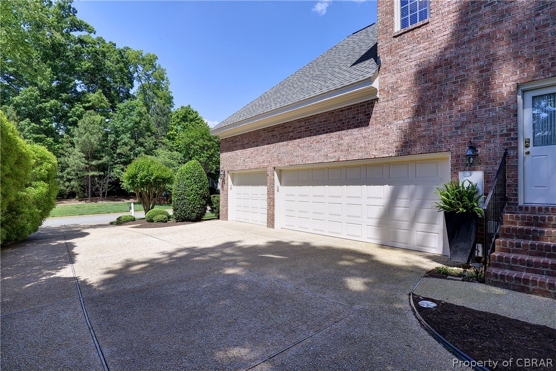 1632 River Ridge Williamsburg, VA 23185 - Photo 47 of 49 a front view of a house with a yard and garage