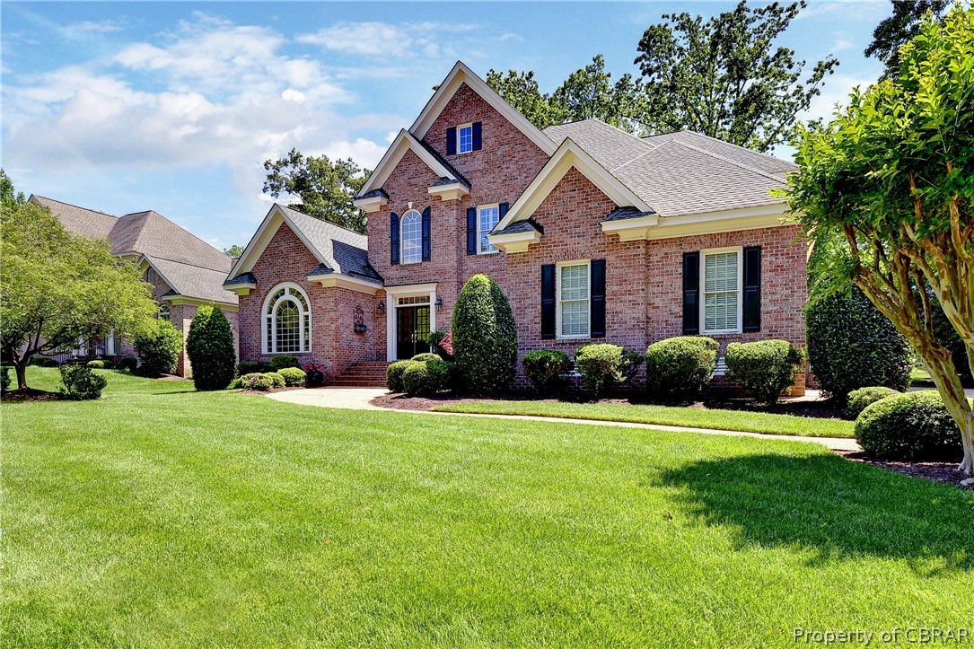 1632 River Ridge Williamsburg, VA 23185 - Photo 49 of 49 a front view of a house with a yard and garage