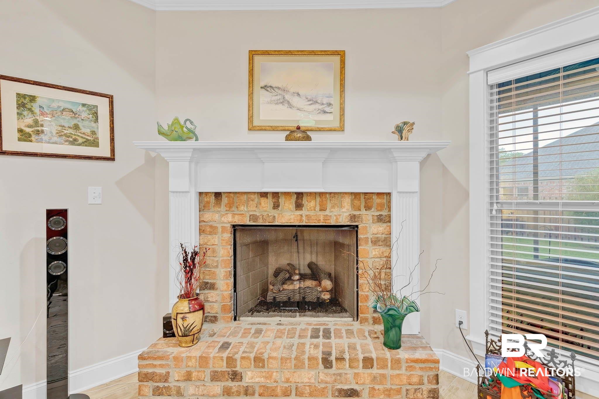 228 Divot Loop Fairhope, AL 36532 - Photo 7 of 26 Detailed view of a fireplace and baseboards