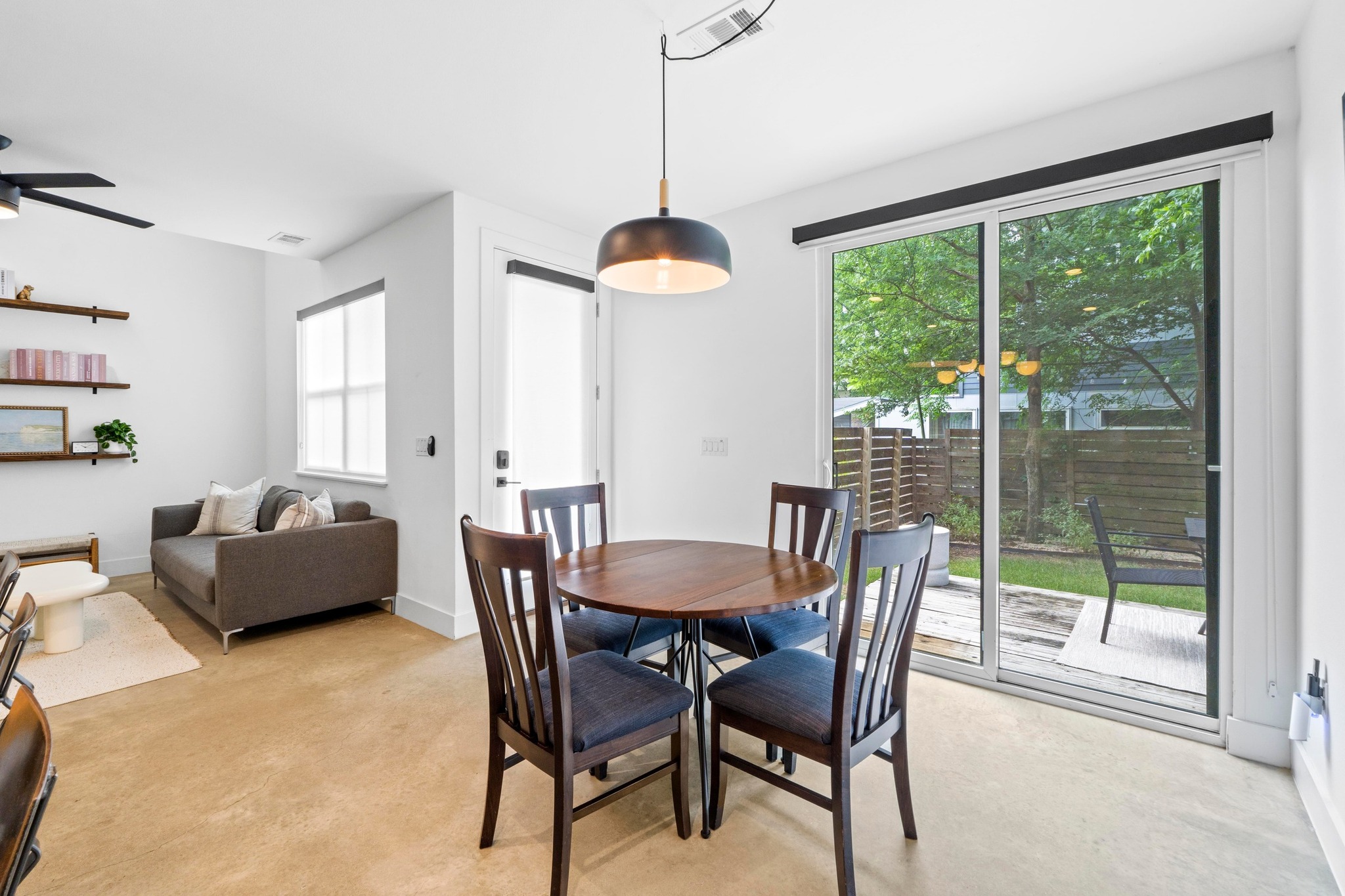 1706 Perez Street, Unit 2 Austin, TX 78721 - Photo 13 of 29 A combined living and dining area provides a seamless transition to the private outdoor space.