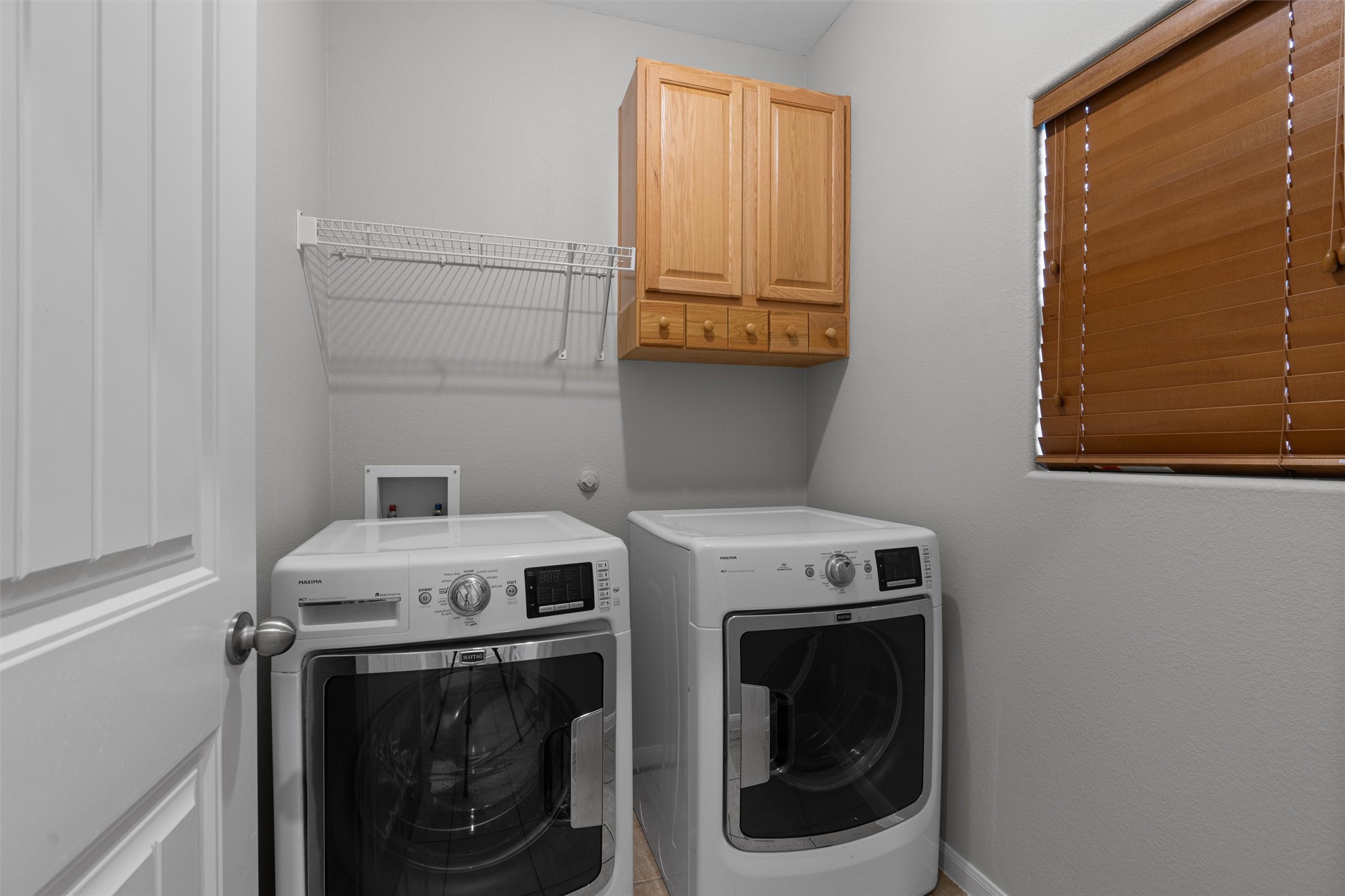 2240 Independence Drive, Unit A83 Austin, TX 78745 - Photo 13 of 34 a utility room with dryer and washer