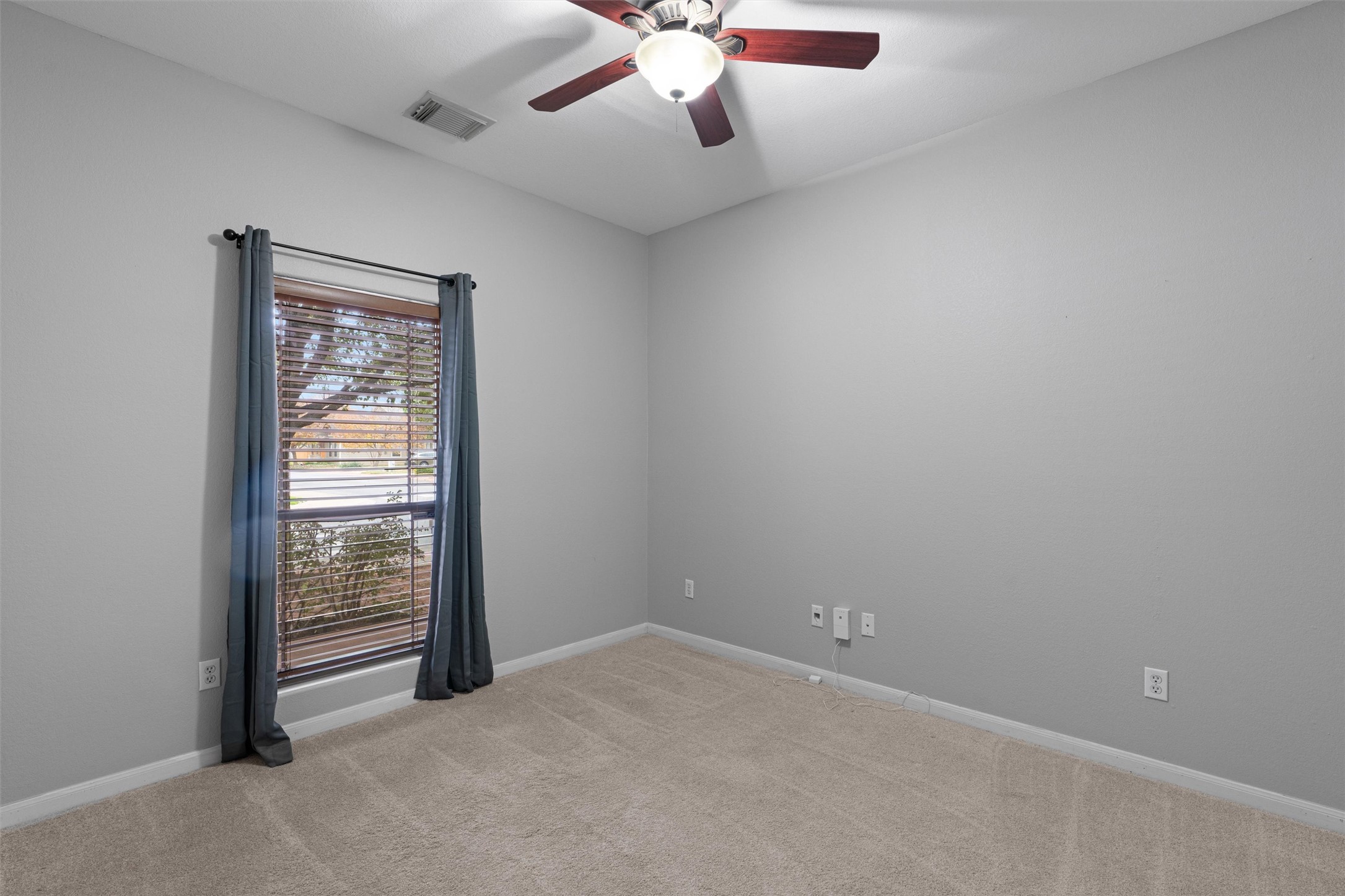 2240 Independence Drive, Unit A83 Austin, TX 78745 - Photo 14 of 34 a view of an empty room with a window