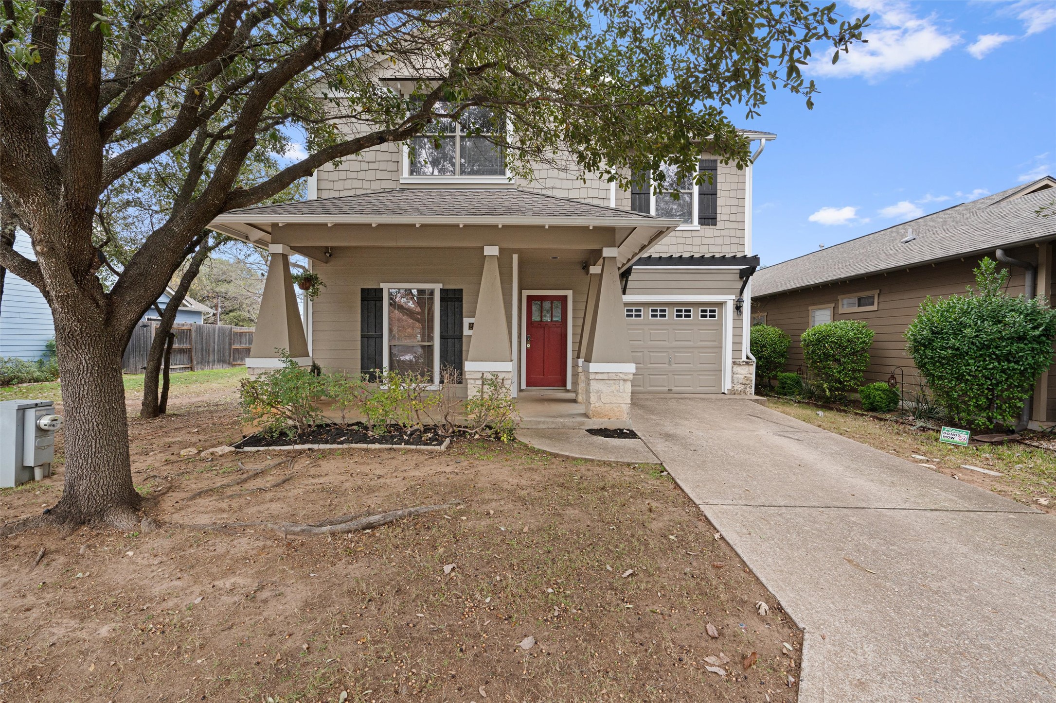 2240 Independence Drive, Unit A83 Austin, TX 78745 - Photo 2 of 34 front view of a house with a tree in front
