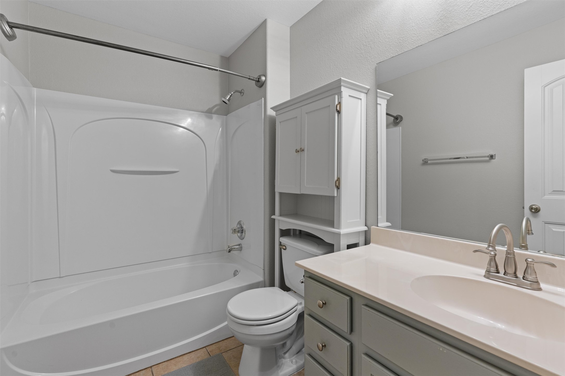 2240 Independence Drive, Unit A83 Austin, TX 78745 - Photo 24 of 34 a bathroom with a sink toilet and shower