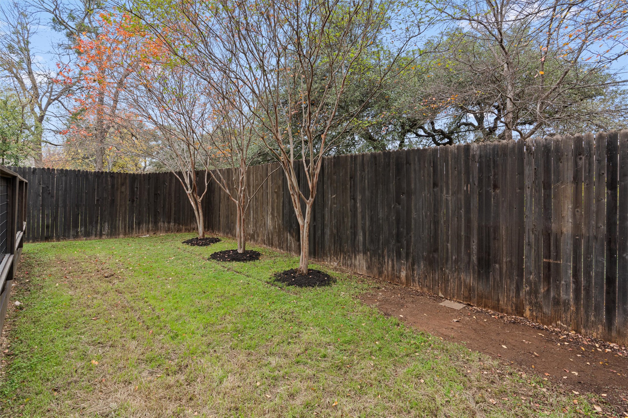 2240 Independence Drive, Unit A83 Austin, TX 78745 - Photo 30 of 34 a view of backyard with wooden fences