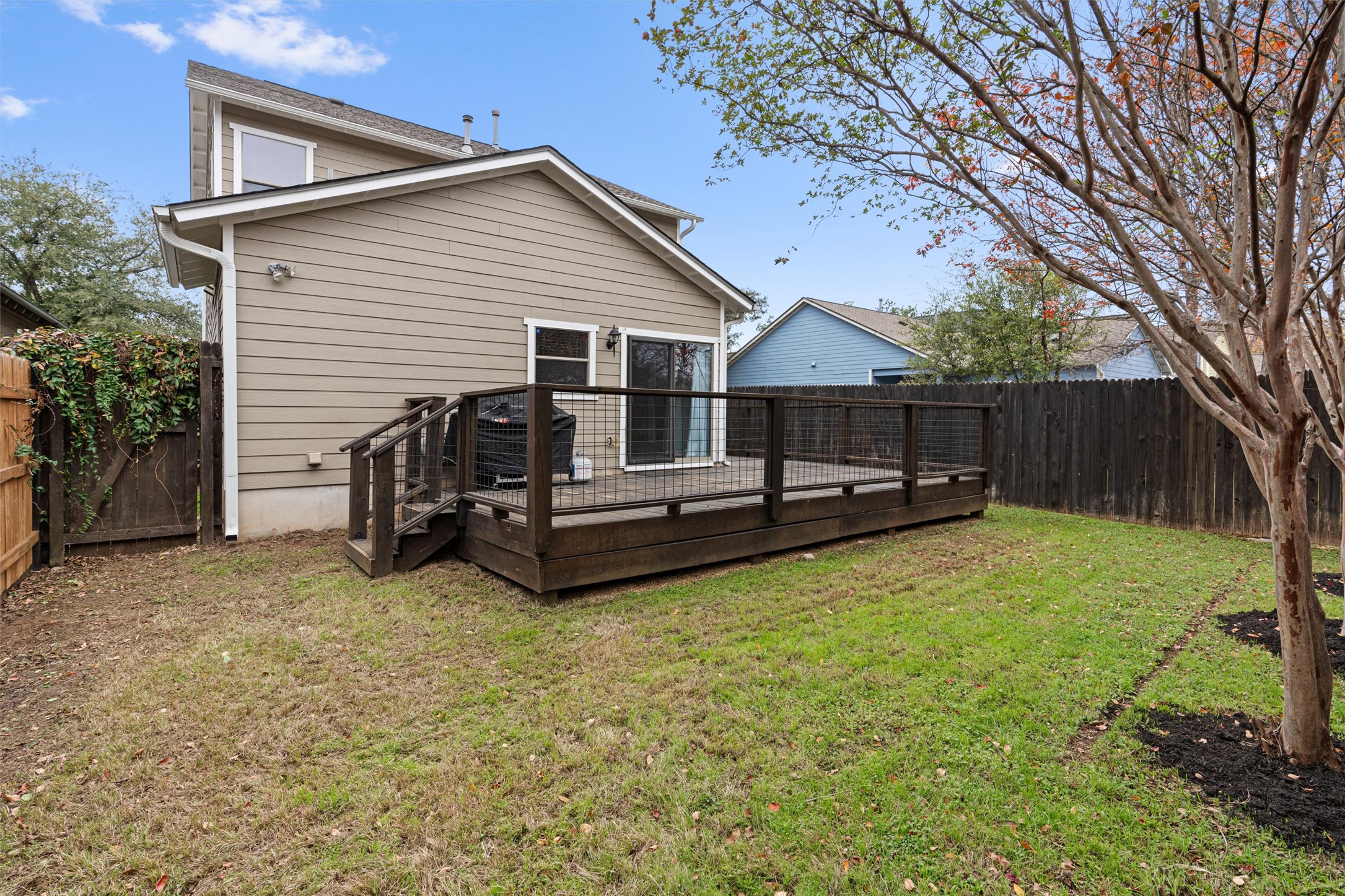 2240 Independence Drive, Unit A83 Austin, TX 78745 - Photo 31 of 34 a view of a house with backyard and a tree
