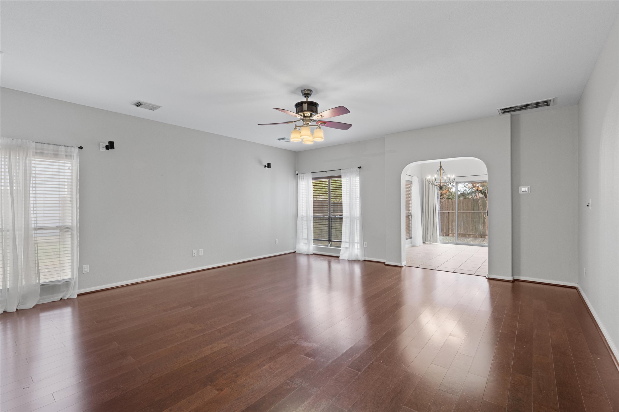 2240 Independence Drive, Unit A83 Austin, TX 78745 - Photo 5 of 34 a view of an empty room with wooden floor and a window