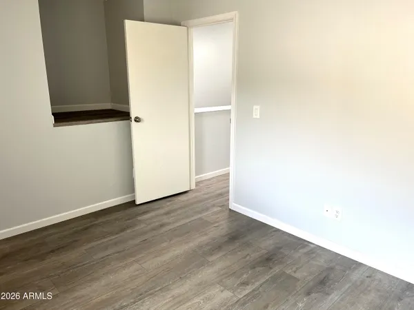 an empty room with wooden floor