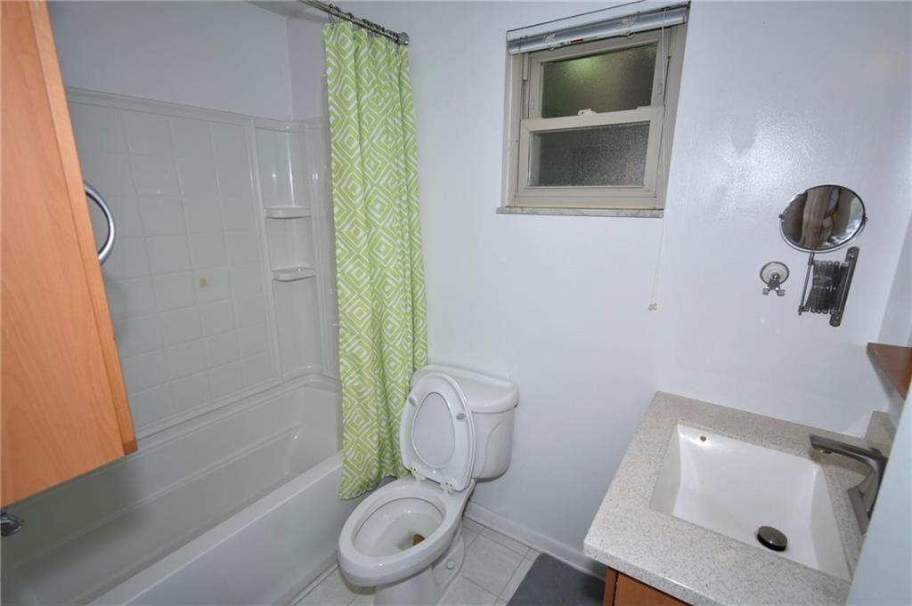 435 Elmer Street Edgewood, PA 15218 - Photo 12 of 16 a bathroom with a toilet and a sink