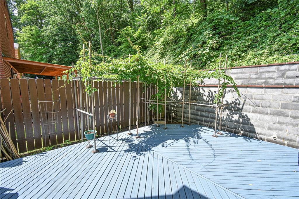 435 Elmer Street Edgewood, PA 15218 - Photo 13 of 16 a view of outdoor space with deck and trees