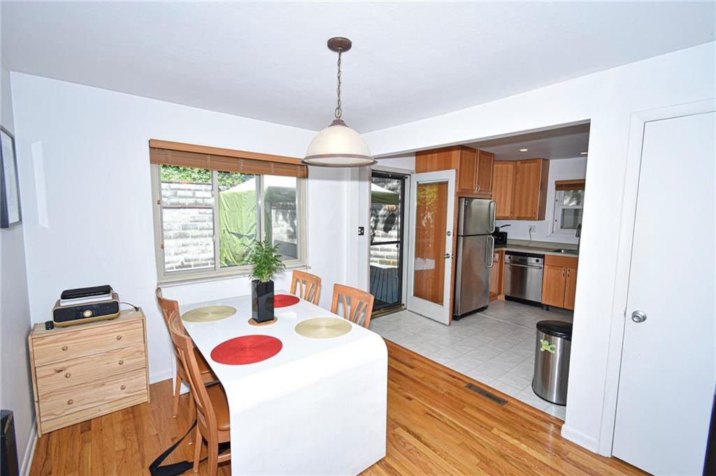 435 Elmer Street Edgewood, PA 15218 - Photo 5 of 16 a living room with stainless steel appliances furniture a chandelier and a view of kitchen