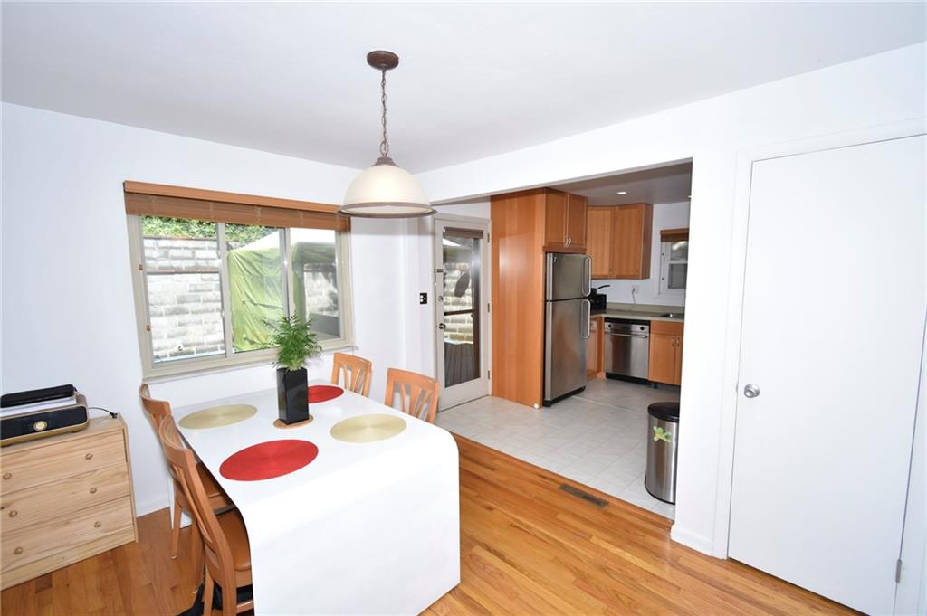 435 Elmer Street Edgewood, PA 15218 - Photo 7 of 16 a living room with stainless steel appliances granite countertop furniture and a chandelier