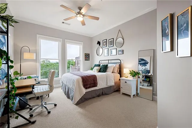 a spacious bathroom with a mirror sink and shower