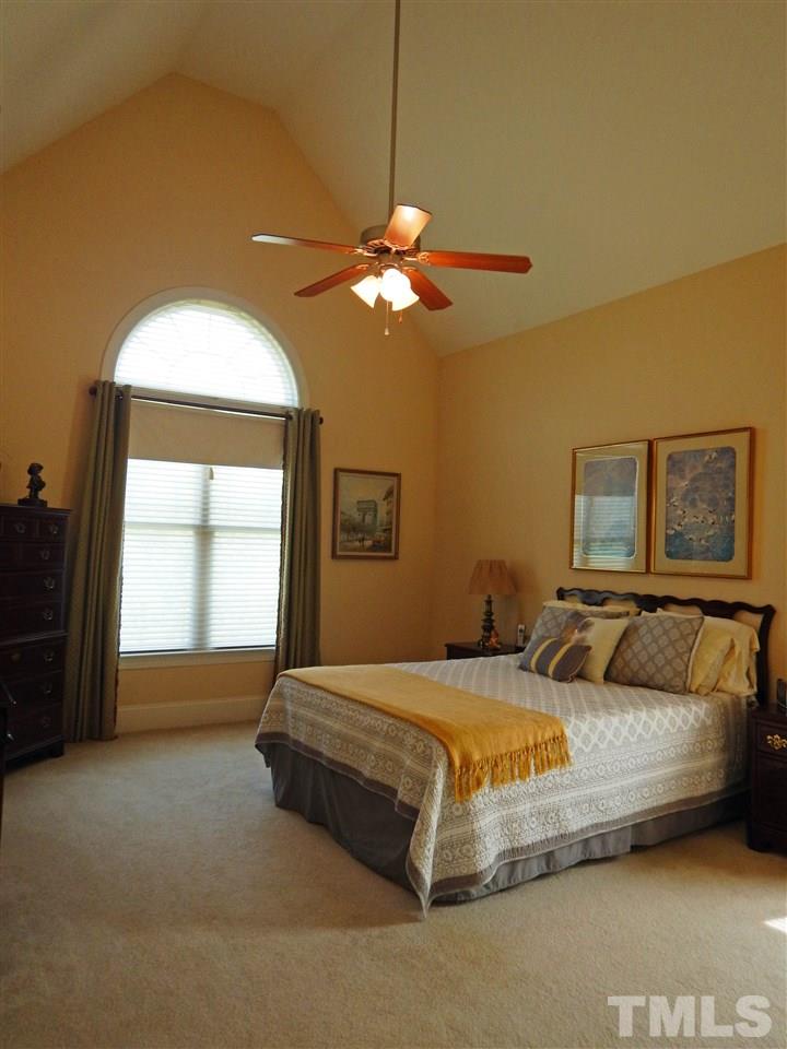 636 Competition Road Raleigh, NC 27603 - Photo 8 of 25 a bedroom with a bed and a window