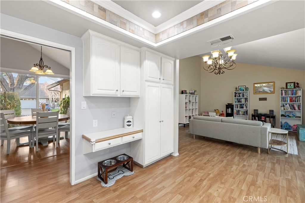 23716 Rotunda Road Valencia, CA 91355 - Photo 13 of 39 a living room with furniture and a chandelier