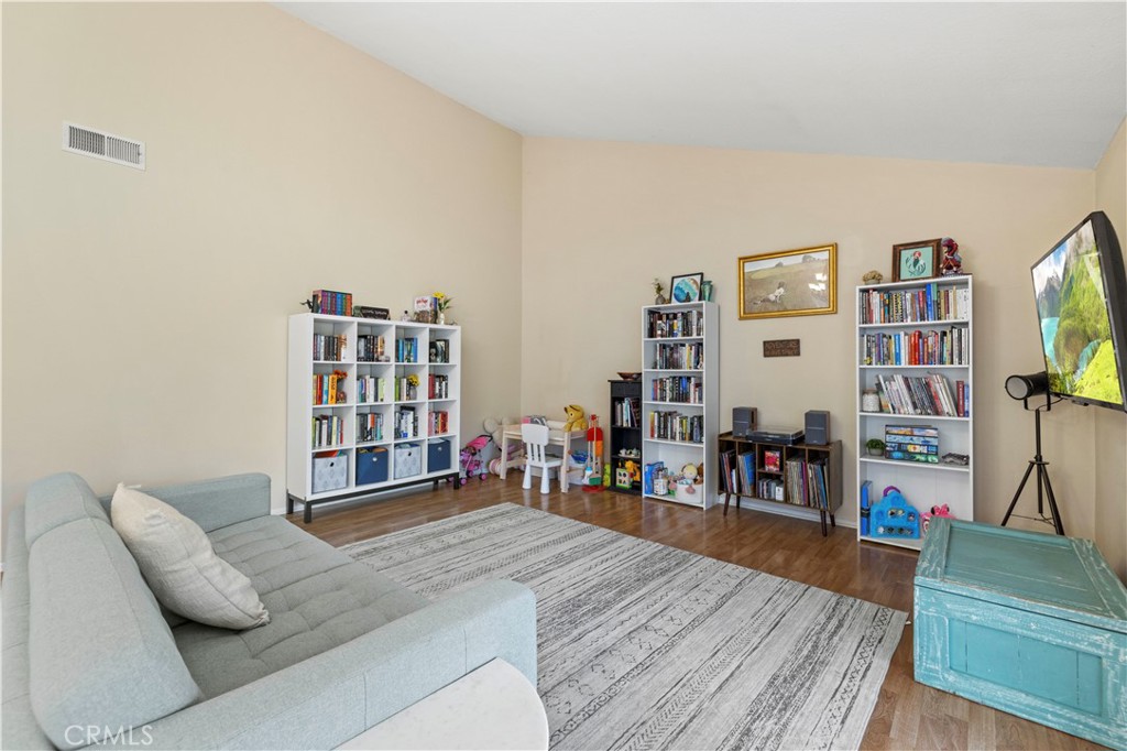 23716 Rotunda Road Valencia, CA 91355 - Photo 30 of 39 a living room with furniture and a flat screen tv