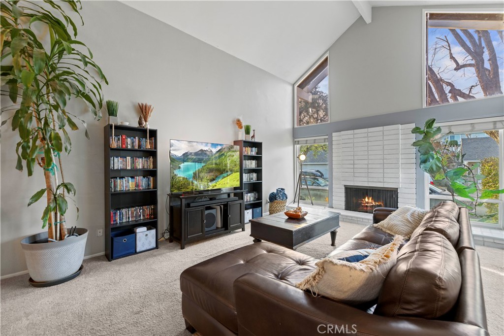 23716 Rotunda Road Valencia, CA 91355 - Photo 3 of 39 a living room with furniture and a bookshelf