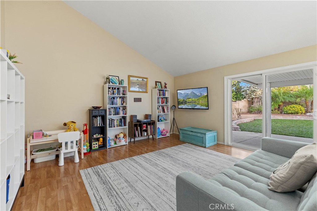 23716 Rotunda Road Valencia, CA 91355 - Photo 31 of 39 a living room with furniture and a wooden floor