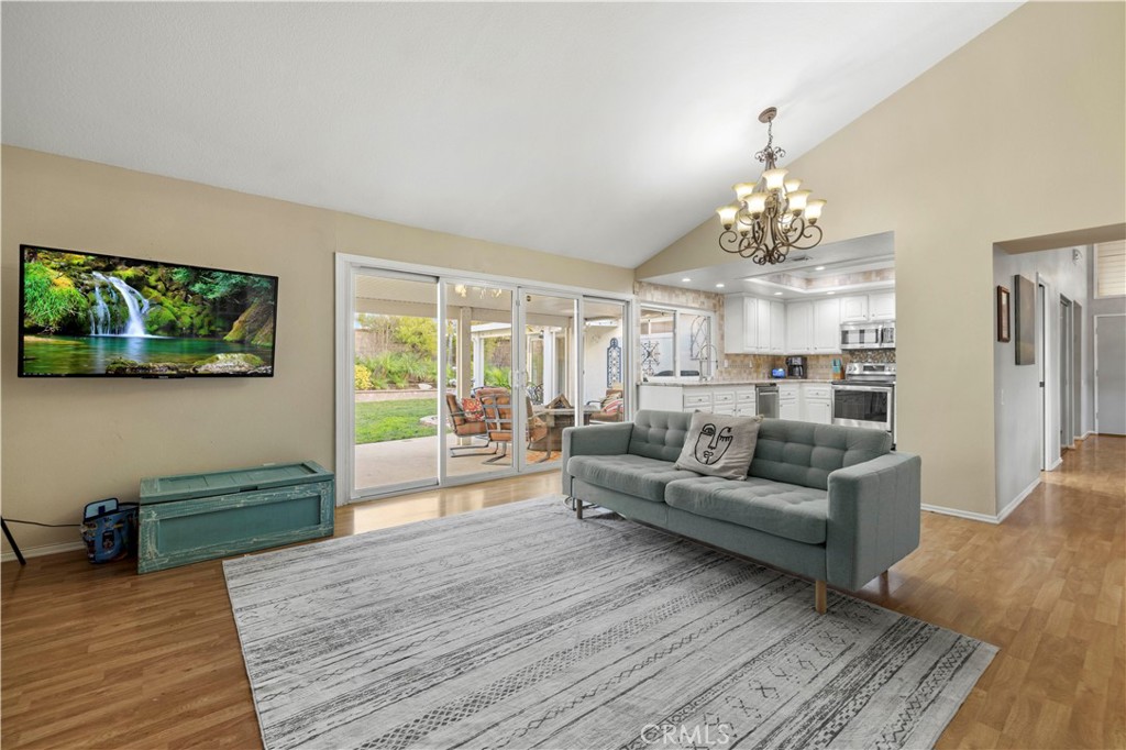 23716 Rotunda Road Valencia, CA 91355 - Photo 32 of 39 a living room with furniture and a chandelier