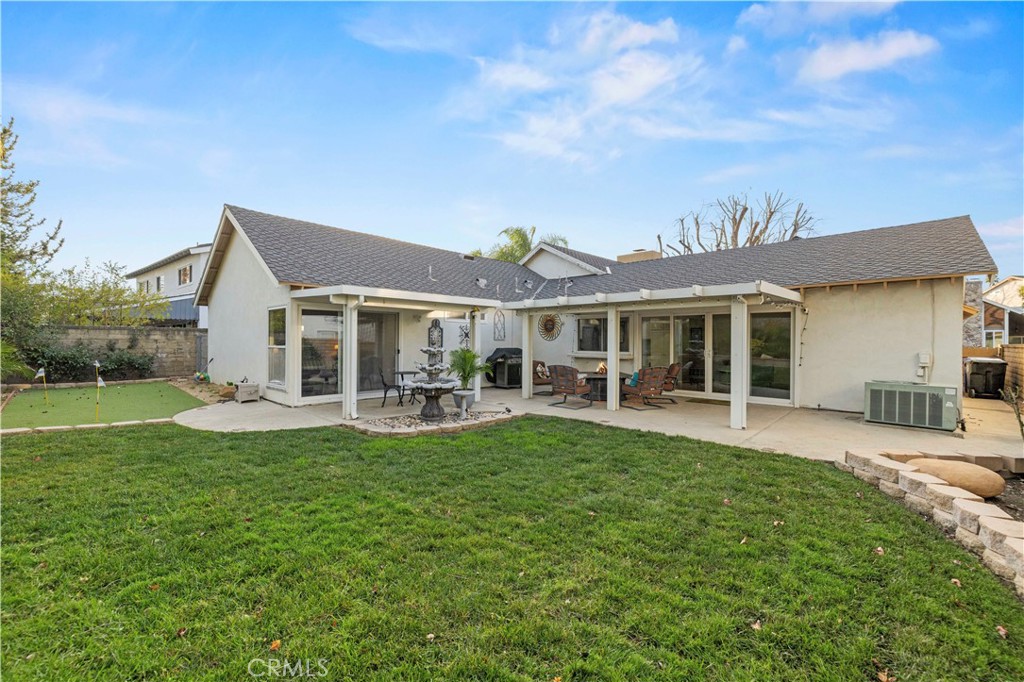 23716 Rotunda Road Valencia, CA 91355 - Photo 36 of 39 a front view of a house with swimming pool having outdoor seating