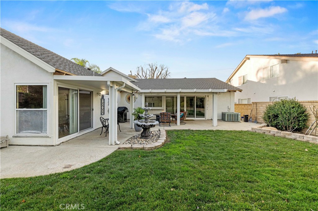 23716 Rotunda Road Valencia, CA 91355 - Photo 38 of 39 a view of a house with backyard porch and sitting area