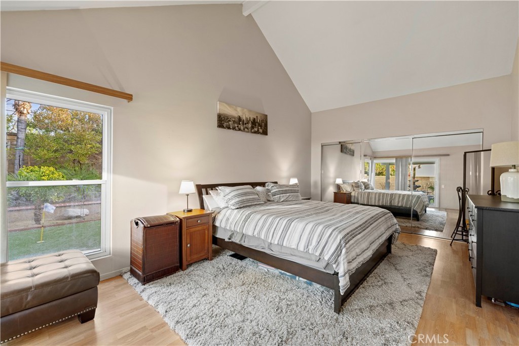 23716 Rotunda Road Valencia, CA 91355 - Photo 8 of 39 a bedroom with a bed and wooden floor