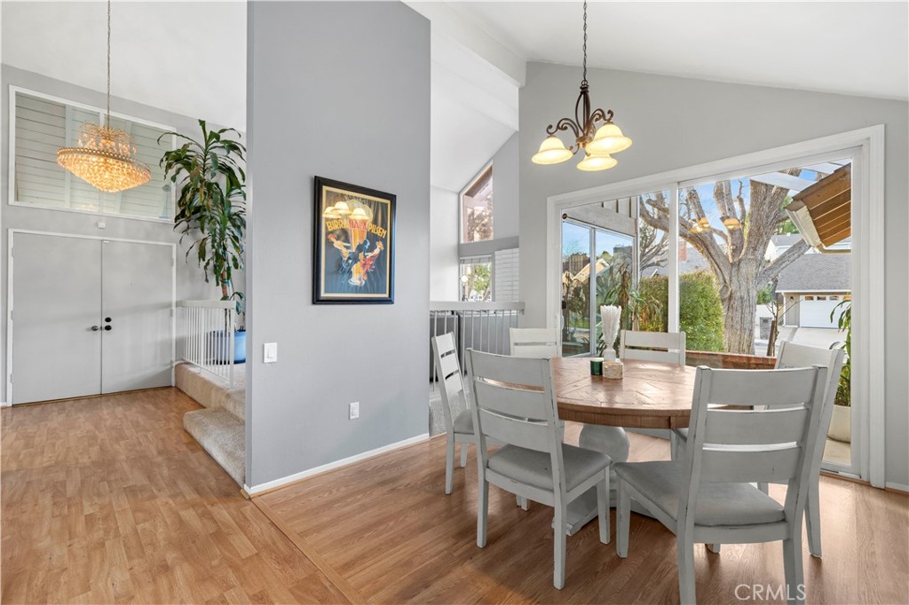 23716 Rotunda Road Valencia, CA 91355 - Photo 10 of 39 a view of a dining room with furniture window and wooden floor