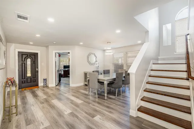 a view of a living room and dining room