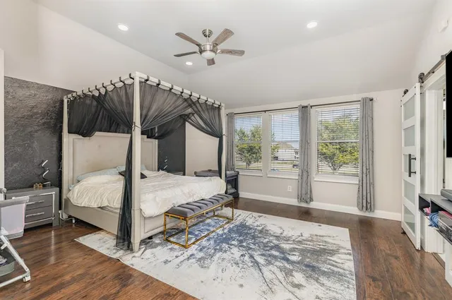 a bed room with a bed and a window