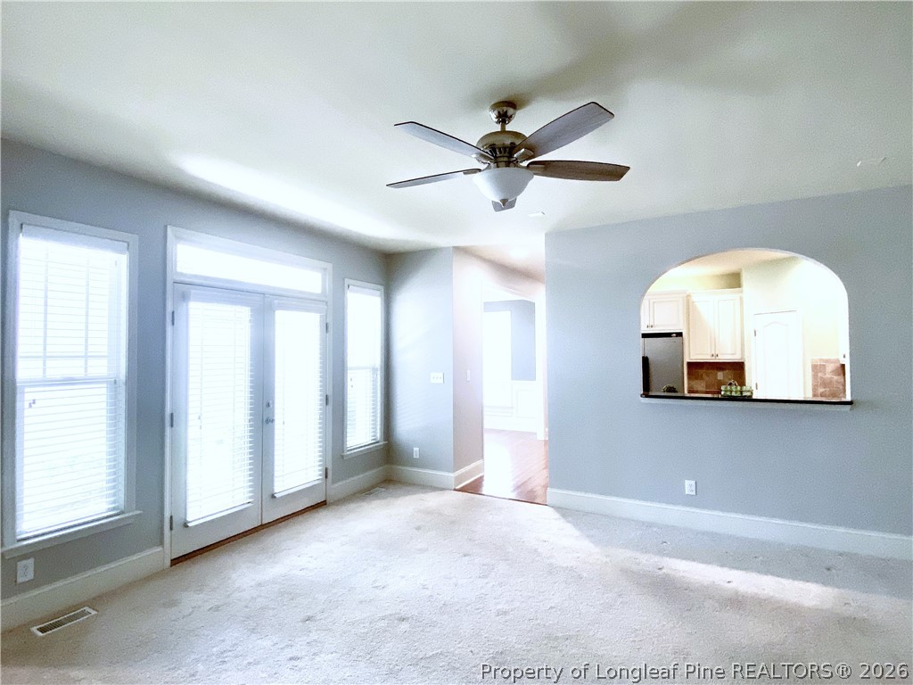 175 Pine Hawk Drive Spring Lake, NC 28390 - Photo 14 of 43 an empty room with a window and a chandelier