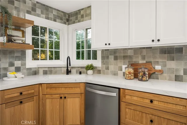 a kitchen with a sink and cabinets