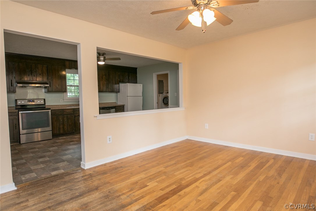 16119 Sandwave Road Chester, VA 23831 - Photo 4 of 41 Freshly painted front room with hardwood floors.
