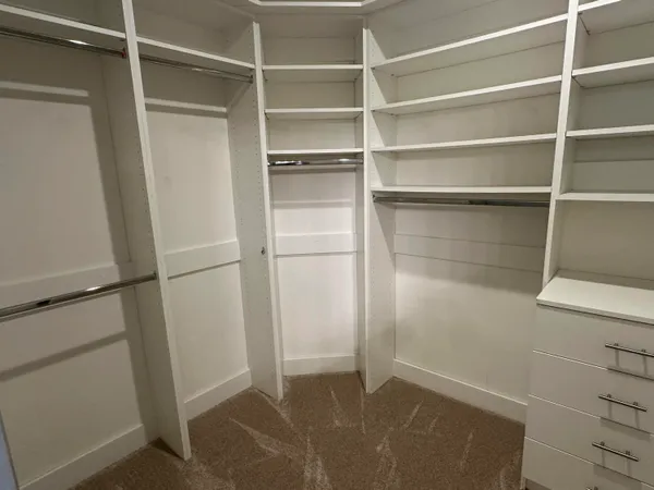 a view of an empty walk in closet
