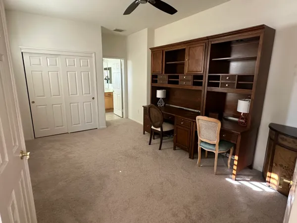 a view of room with furniture and closet