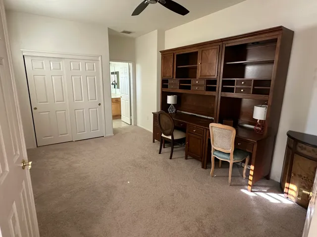 a view of room with furniture and closet