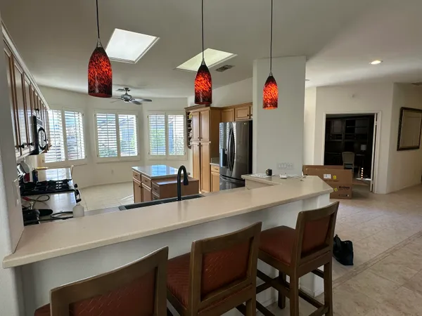 a group of dining room with furniture and window